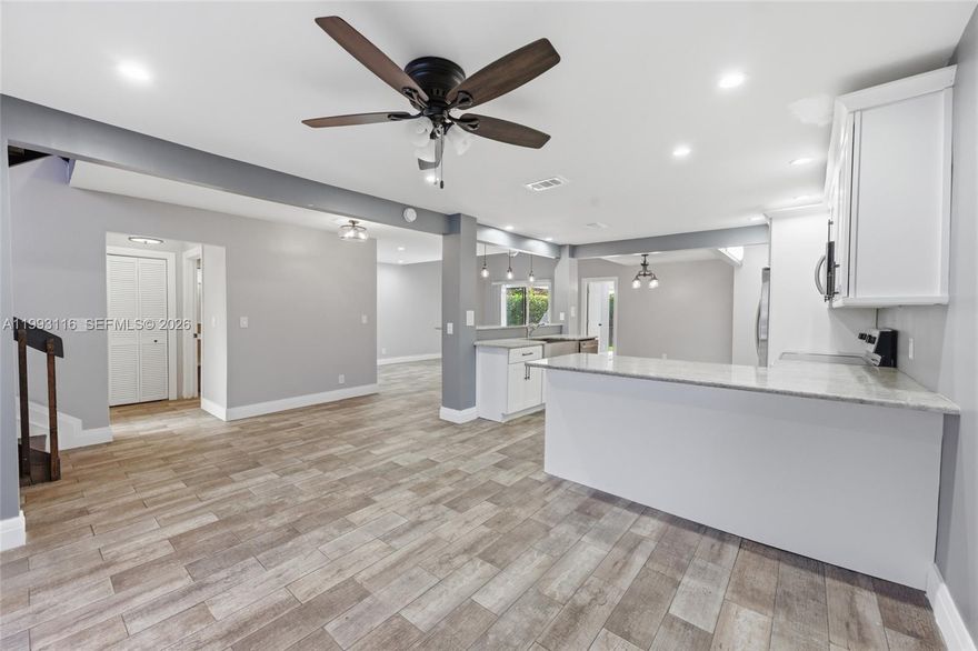 Wow! Stunning 3 Bed/2.5 Bath Modern Wood-Siding Townhome In Banyan Lakes, Tamarac! 2 Assigned Parking. The Layout Features A Spacious Living Room, Formal Dining Area, And A Breakfast Nook Just Off The Kitchen. The Kitchen Is Equipped With Stainless Steel Appliances- Dishwasher, Electric Gas Range, Microwave, and Refrigerator- And Bar-Style Eat-In Countertop Perfect For Casual Dining Or Entertaining. Primary Suite Conveniently Located On The First Floor With Walk-In Closet, Ceiling Fan, And Access To Sun Room. Primary Bath Has Shower & Quartz Countertop. Family Room Boasts Its Volume Ceiling Offering Spacious Volume & Soaring Verticality That Floods The Home W/ Natural Light. Upstairs Are Two More Bedrooms With Ceiling Fans That Shares A Bathroom With Shower/Tub Combination. A Versatile Loft Space That Can Be Used As An Office, Media Room, Or An Additional Living Area. Loft Overlooks The Family Room Downstairs. Tile Flooring Runs Through Entire Home. Newer Roof 2019. Washer/Dryer. Step Outside To A Private Back Patio Ideal For Relaxing Or Hosting. Property Offers Solid Value And Functionality. HOA Includes Landscaping And Community Amenities. Owners Are Responsible For Their Own Insurance And Water. Great Opportunity For A Primary Residence Or Investment With A Flexible Layout And Desirable Features. Schedule Your Showings Today!