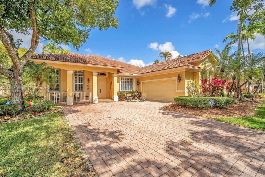 BEST PRICED IN AREA! Beautiful one-story corner residence offering 4 bedrooms and 2.5 bathrooms, filled with abundant natural light and thoughtfully designed spacious living areas that create an inviting and elegant atmosphere.

The chef’s kitchen is the heart of the home, featuring custom-built cabinetry, a large island, double sink, two ovens, and an oversized double pantry, perfect for both everyday living and entertaining. Major appliances including the washer, dryer, microwave, and refrigerator are 2 years old or newer, adding modern convenience and value.

This well-maintained property also includes accordion hurricane shutters, providing peace of mind and storm protection.

Located in one of Weston’s most desirable communities, residents enjoy top-rated schools and access to one of the finest clubhouses in all of Weston, offering exceptional amenities and an outstanding lifestyle.