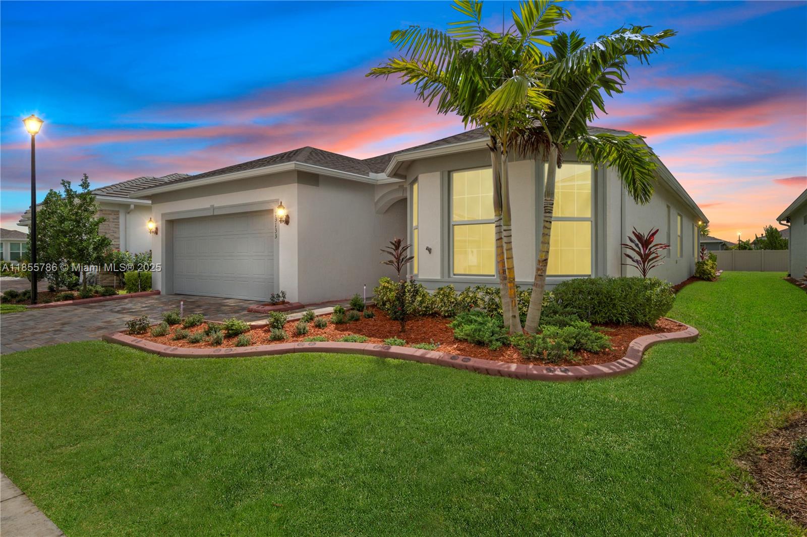 Discover the beautifully designed Mystique Floor Plan, built in 2024, within the sought-after Del Webb at Tradition 55+ Gated Community. This home showcases stylish tile flooring and a generous kitchen island, perfect for gatherings. The kitchen features top-tier appliances, including a gas range and oven.Enjoy a spacious layout with a large owner's suite and a luxurious bathroom with a walk-in shower. The tandem three-car garage offers plenty of room for vehicles and storage.Step outside to a fully fenced backyard with vibrant landscaping and decorative curbing. Additional features include power blinds and epoxy garage floors with extra cabinets. This home is a fantastic find!