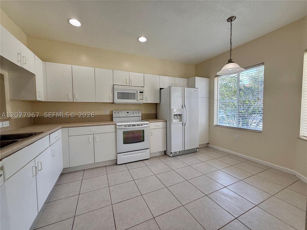 Photo of 8219 SW 27th St #102, Miramar, FL 33025 (MLS # A12077967)