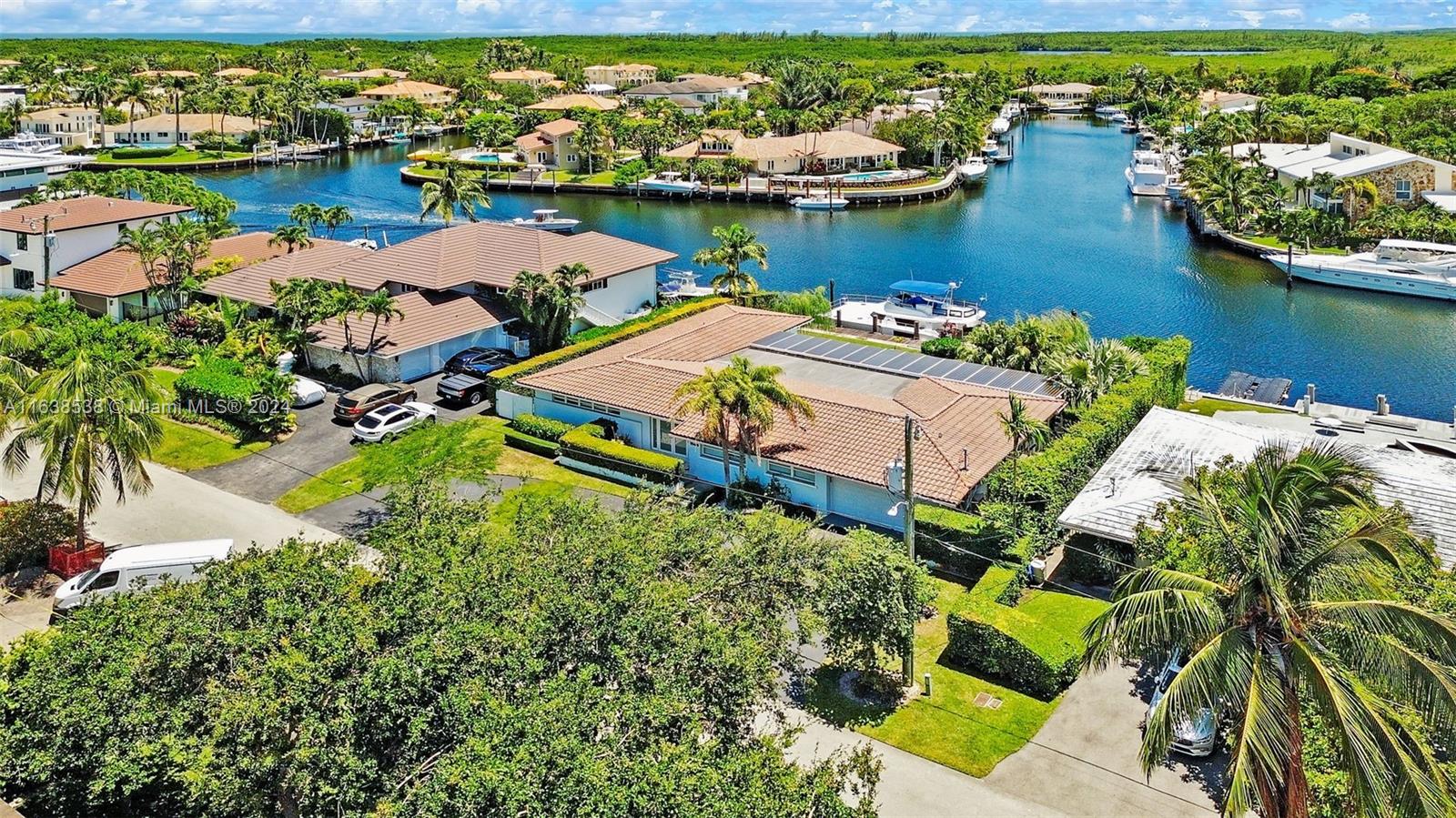 Enjoy the best waterfront living in this beautiful remodeled home, perfectly positioned on a T-style wide section on the waterway, offering breathtaking, uninterrupted views and direct access to Biscayne Bay with NO BRIDGES. This stoning residence features 3 bedrooms plus an office (which can easily serve as a 4th bedroom) and 4 full bath, open yet intimate floor plan invites you to fully appreciate the sweeping views. Picture yourself enjoying a morning coffee in the living room as graceful Great Engrets with their long necks and yellow beaks, glide by, or savoring an aperitif with friends on the terrace as the sun sets on the horizon.