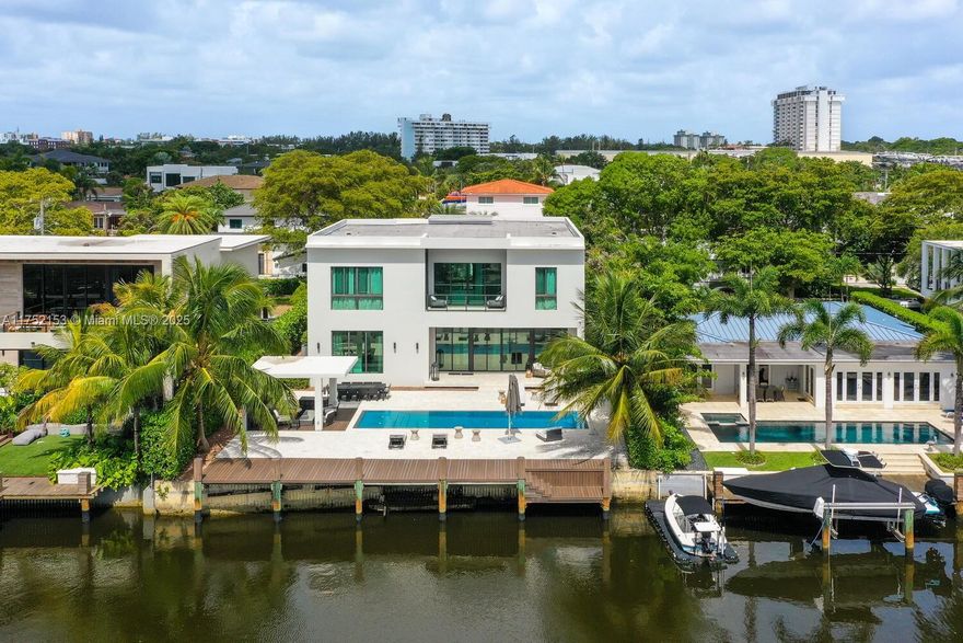 Welcome to "Casa Coronado", where luxury meets the serene beauty of waterfront living in the prestigious Keystone Point community. This contemporary masterpiece features 8 bedrooms and 8.5 bathrooms, seamlessly blending refined interiors with opulent indoor and outdoor living spaces. The residence boasts a 75-foot dock and a private elevator, encapsulating comfort and sophistication. The open floor plan, accentuated by 12-foot ceilings, radiates elegance and style.bIndulge in the exquisite lap pool, relax in the gazebo with BBQ, and enjoy the gourmet chef’s kitchen equipped with a gas stovetop. Each room is thoughtfully designed with a safe box, built in closets space. Conveniently located just 11 minutes from Bal Harbour Shops and 30 minutes from both MIA and FLL.