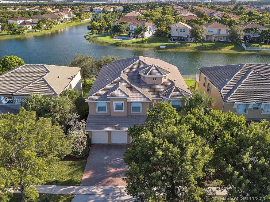 Beautiful 4,245 sq ft, waterfront 5 bedroom, 4.5 bath home in resort style, manned gated community of Riviera Isles. Big gourmet eat-in kitchen w/ ss appliances, double refrigerators, corian counters, huge walk-in pantry. Plantation shutters, Impressive formal dining room with butler's pantry. Large master suite with its own private balcony, walk–in closets and superb fully upgraded master bath. Wood flooring, impressive laundry room and loft upstairs. Covered patio and fully fenced waterfront lot. Accordion shutter hurricane protection. Resort-level amenities include waterfall pool, fitness center, tennis courts and two manned gates. Grade A schools, parks and many choices for shopping and dining nearby. Close to I-75 for easy commutes in every direction.