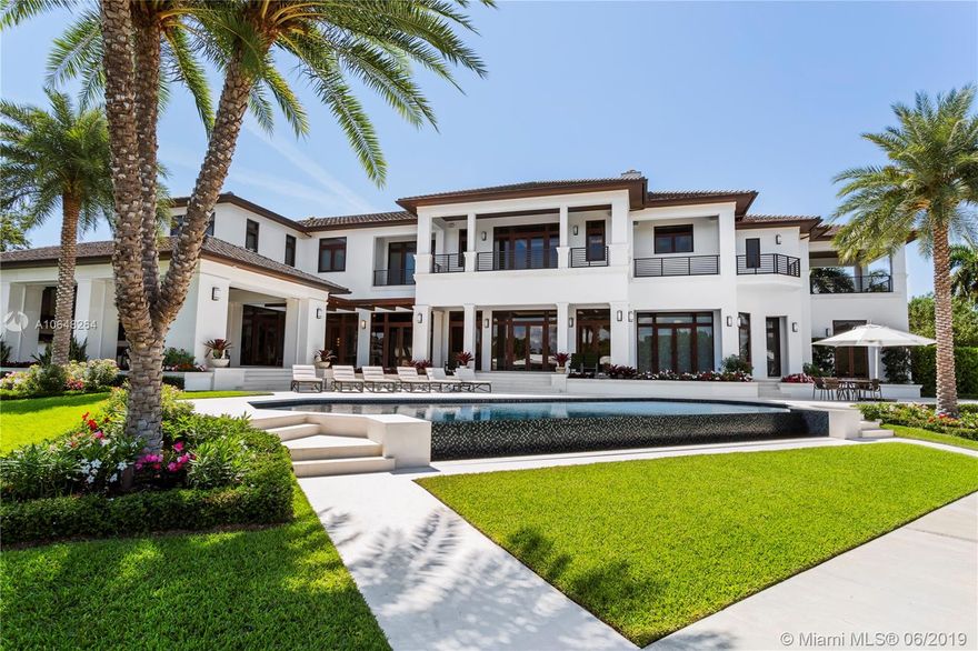This newly constructed, modern yet transitional masterpiece has single-handedly changed the tone of the Gables Estates waterfront landscape. 115 Arvida is now available for the discerning buyer who demands the utmost in quality and well thought out design by Pacheco Martinez & Associates. Completed in 2018, the expansive 14,713 square-foot home includes an array of luxury and security features and 280 feet of pristine water frontage. The soaring ceilings give an air of grandeur, while rich stone floors and mahogany woodwork are unified throughout.  The master bedroom suite is the ultimate escape, with a massive bathroom and three terraces. The property has 280 feet of water frontage on two sides, taking advantage of spectacular views and direct ocean access from the new seawall and dock.