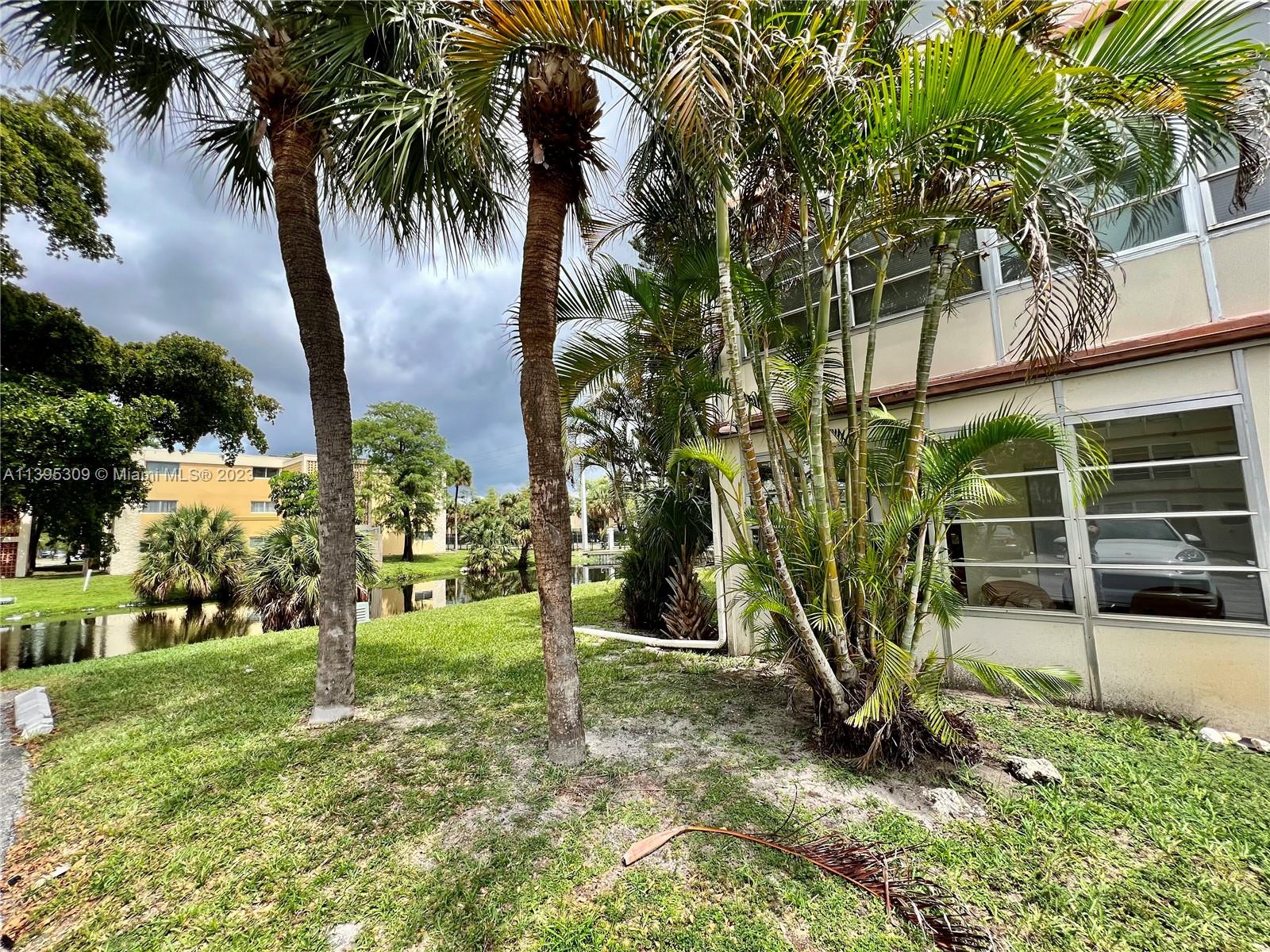 LARGE CORNER unit DIRECTLY ON THE FIRST FLOOR with 2 bedrooms and 2 bathrooms. PARK RIGHT IN FRONT of your home and ENTER FROM YOUR FRONT PORCH. QUIET WATER VIEWS from your extra large WRAPAROUND PORCH or from your dining room. Nice and convenient OPEN FLOOR PLAN with TILE FLOOR THROUGHOUT (no carpet), Large bedrooms with WALK-IN CLOSETS & lots of storage. ALL AGES WELCOME! Close to the golf and Walmart, community with pool, Shuffleboard, Bacci, gym and more. Low maintenance fees. Washer and Dryer on every floor. CASH ONLY