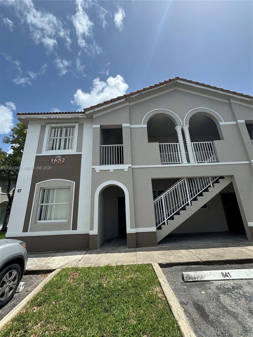 Located in the desirable Keys Cove gated community, this spacious first-floor unit features 3 bedrooms and 2 bathrooms. Enjoy tile flooring throughout, walk-in closets, and  hook up for washer and dryer. Community amenities include two pools, a clubhouse, and a playground, along with 24-hour security surveillance. Ideally situated close to shopping and the Turnpike,  and new sports HUB with a brand-new Publix within walking distance.