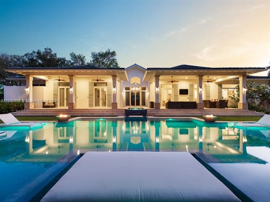 Extraordinary tropical islander architecture located in a quiet & gated cul-de-sac community of just 4 exclusive homes. This exquisite home features an elegant vaulted front porch w/IPE beam accents & pristine landscaping. Discover a gorgeous foyer entrance w/high ceilings & amazing flr plan featuring a den/home office, rec rm w/temp-controlled wine-cellar, open concept family rm overlooking dining rm & chefs eat-in kit w/custom cabinetry, top-of the line appl & butler’s pantry. Master ste offers sitting area, his/her WIC & spa bath w/soaking tub & coral wall outdr shower. Experience the ultimate outdr retreat w/covered terraces, gazebo w/summer kit & lavish pool w/water feature, 2 sun shelfs, floating tanning bed & 4 fire bowls. Other Features: marble flrs, laundry/mudrm & 2 car gar.