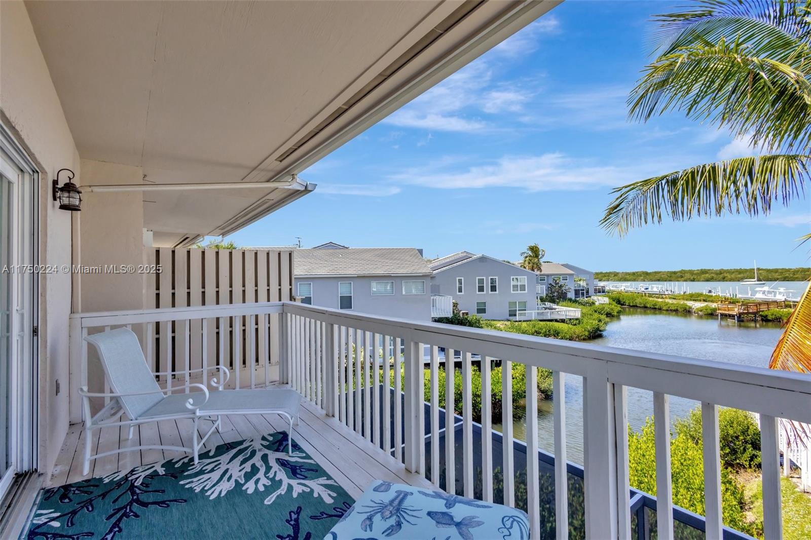 Renovated waterfront townhome with dock access - 2470 Harbour Cove Drive, Hutchinson Island This 3-bedroom, 2.5-bathroom, 2-car garage townhome offers breathtaking views of the Intracoastal Waterway and has been completely renovated. Upgrades include a new roof, impact glass throughout, and hurricane-rated doors and garage doors for peace of mind. The open-concept living space features a gourmet kitchen with custom hickory wood cabinetry, granite countertops, and stainless steel appliances. The spacious dining area is surrounded by large windows with plantation shutters, allowing for natural light and serene water views. A wet bar with built-in shelving adds to the home's functionality, perfect for entertaining.