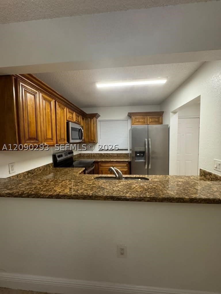 Photo of 1566 Lake Crystal Dr #E, West Palm Beach, FL 33411 (MLS # A12090293)