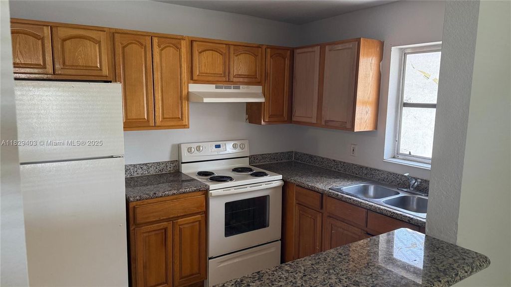 Photo of 4160 NW 21st St #215-E, Lauderhill, FL 33313 (MLS # A11829403)