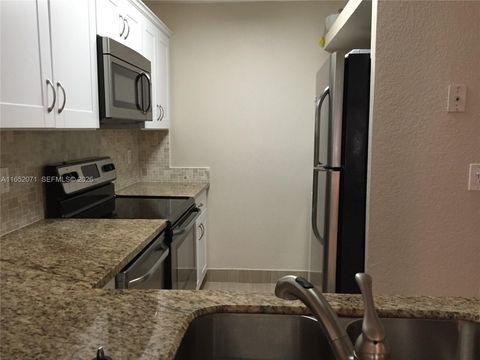 Photo of 1028 Twin Lakes Dr #21-C, Coral Springs, FL 33071 (MLS # A11652071)