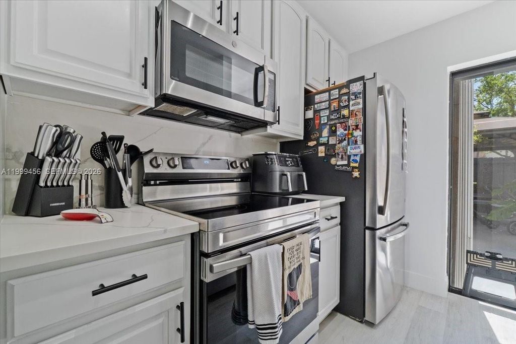 Photo of 3627 Cocoplum Cir #34114, Coconut Creek, FL 33063 (MLS # A11999456)