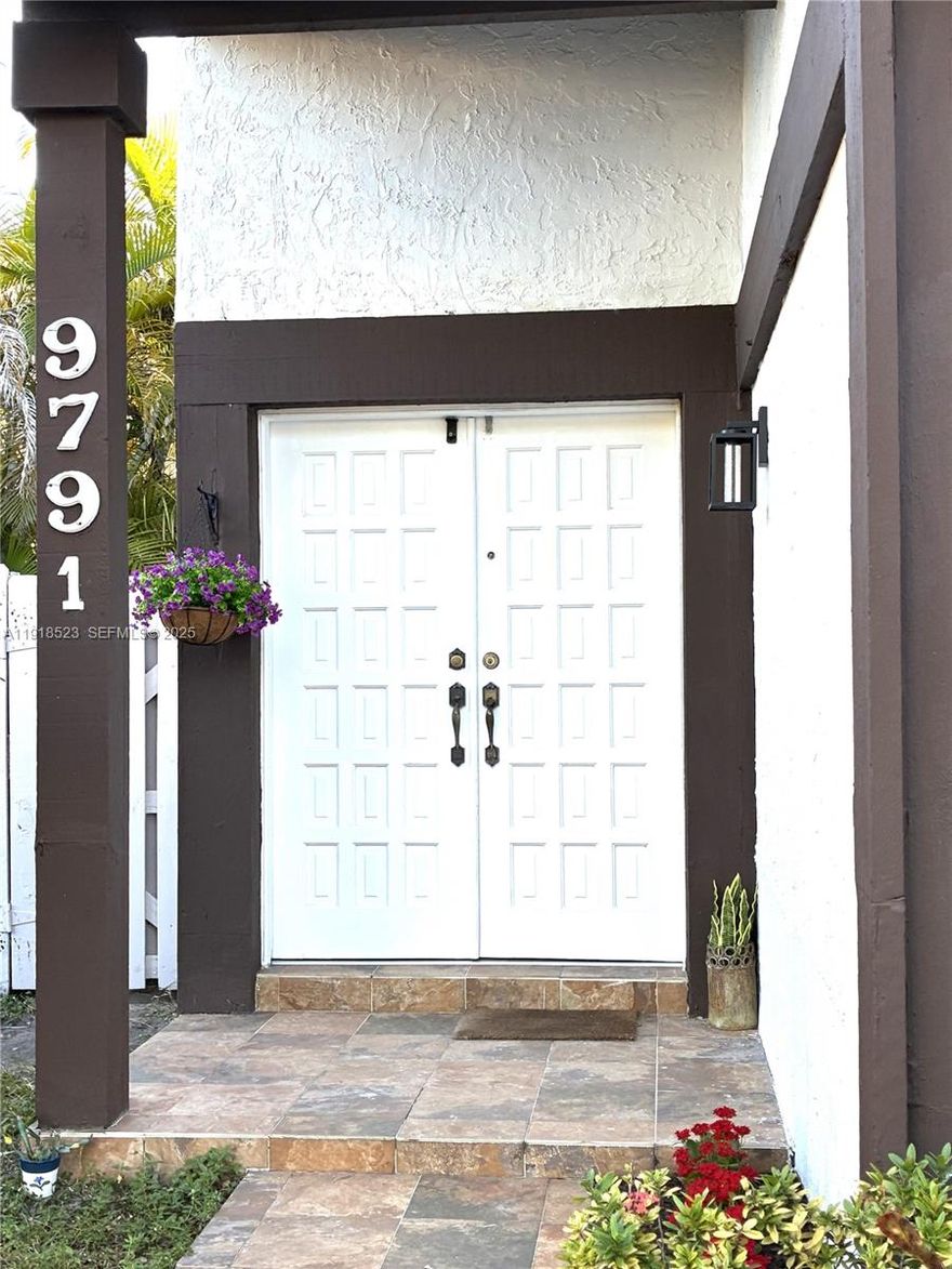 Beautiful lakefront home located in The Hammocks on a quiet cul-de-sac. This bright and spacious 3-bedroom, 2-bath residence features an open-concept kitchen with granite countertops, stainless steel appliances, and an in-unit washer and dryer. The home offers tile flooring throughout, updated bathrooms, and a fenced backyard with direct access to the stunning walking, jogging, and biking paths that surround the lake.Enjoy peaceful lake views right from your backyard. The home is in a prime location, close to supermarkets, dining, and all the conveniences the area has to offer. Residents of The Hammocks enjoy exceptional community amenities, including 20 natural-style pools, a gym, a community clubhouse, and tennis and volleyball courts, as well as additional swimming facilities.