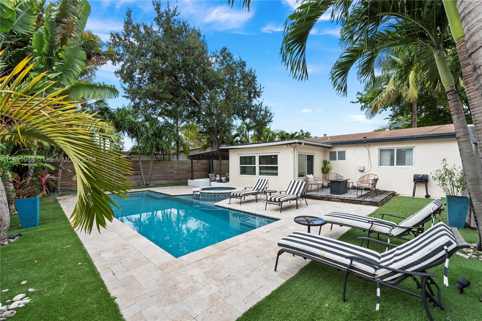 Discover this beautifully furnished, modern three-bedroom, two-bath home, ideally located in Fort Lauderdale and just minutes to the Beach. Enjoy a newly renovated backyard oasis with a pool perfect for relaxation and gatherings. The spacious, chef’s kitchen includes an eat-in area, complemented by a formal dining room, bright living room, and cozy den. With new AC, impact windows and doors, and porcelain floors throughout. Parking for up to 6 vehicles. Conveniently close to shopping, cafes, and schools, it's ideal for a full-time residence & home for a family or a vacation retreat. Contact us anytime for a private tour!