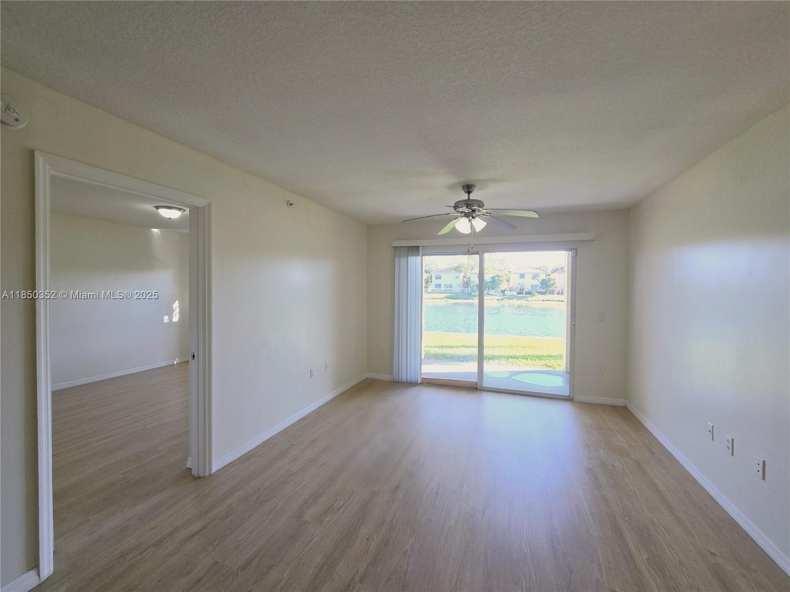 This beautifully maintained 2-bedroom, 2-bath split-plan condo is located in the sought-after gated community of Emerald Isles. Featuring an upgraded kitchen with stainless steel appliances, updated bathrooms, and laminate/tile floors throughout, this home is in pristine condition. Enjoy peaceful, wrap-around lakefront views right outside your door, along with resort-style amenities including a designer pool and clubhouse. The central location provides easy access to schools, shopping, dining, and is just minutes from I-95 and the Turnpike. Ideal for both comfortable living or as an investment property. Don’t miss this opportunity!----------UNIT RENTED TILL 12/31/2025, PAYS $1,900.00 PER MONTH - TENANT CAN SHOW THE UNIT WITH 24HS NOTICE