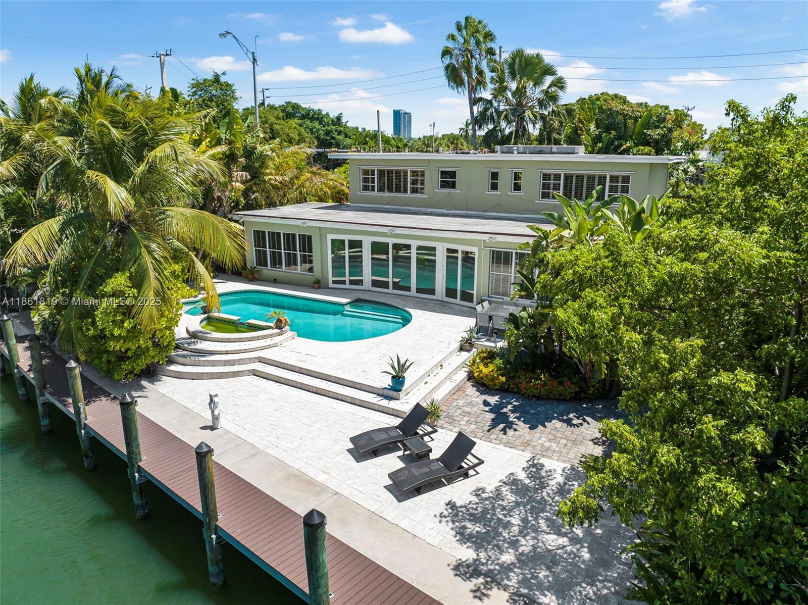 Nestled on one of Miami Beach’s most prestigious streets, this 4-bed, 3-bath waterfront residence offers spacious living with sweeping water views and direct bay access—the best of both worlds. Whether you’re lounging poolside under swaying palms or entertaining in the gourmet kitchen, every corner of this home is designed for relaxed, coastal living. Set on a 10,270 sqft lot with 101 ft of prime water frontage, the property is perfect for boating enthusiasts and those seeking serene water views. Natural light pours through the open interiors, and the backyard oasis features a sparkling pool overlooking the water. Located just minutes from Sunset Harbour, the Miami Beach Golf Club, parks, beaches, and world-class dining, the home offers an unbeatable lifestyle in a truly central location.