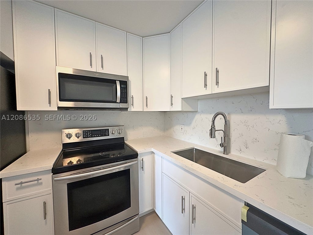 Photo of 13475 SW 9th St #302A, Pembroke Pines, FL 33027 (MLS # A12086535)