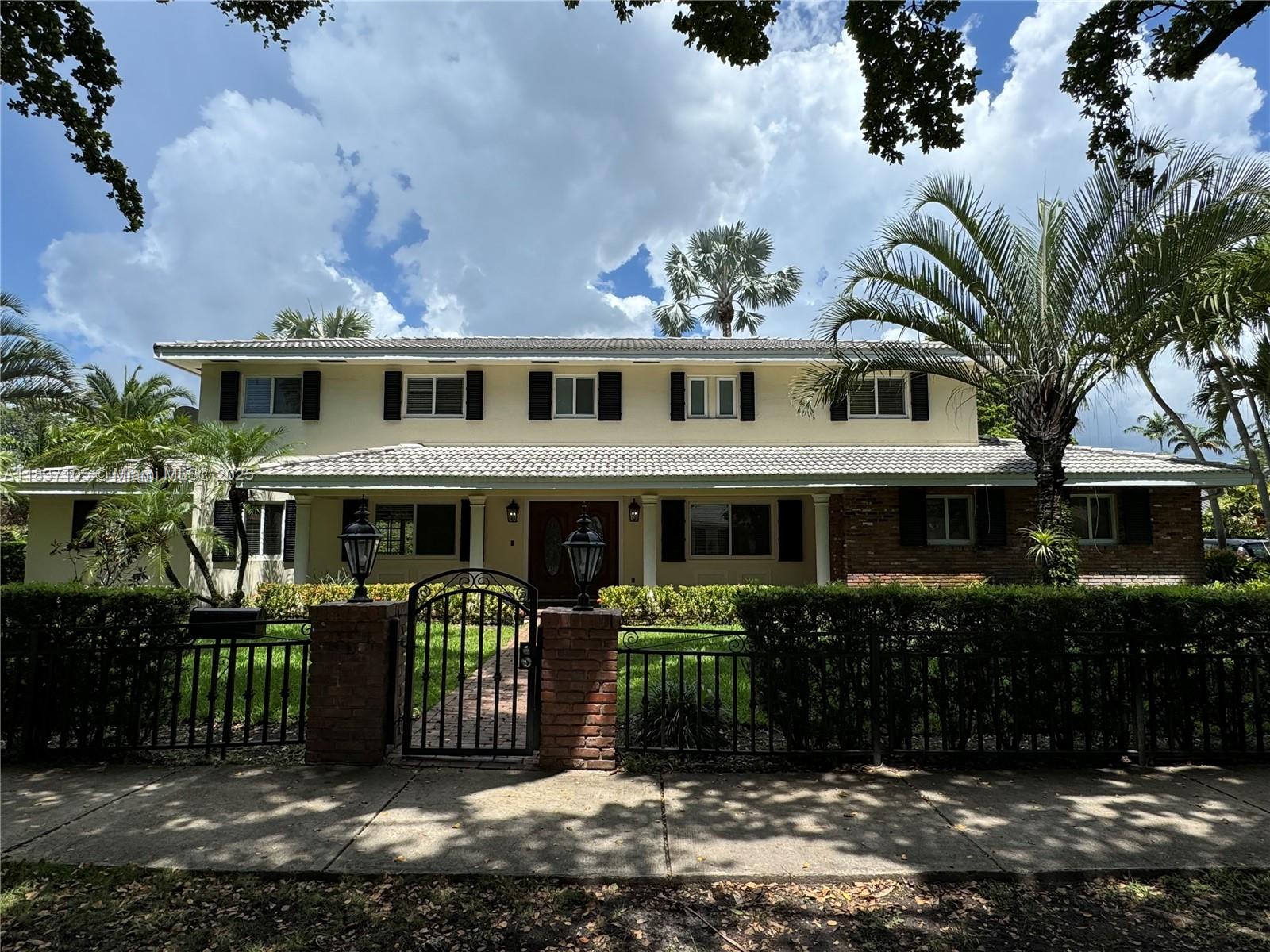 This impeccably maintained two-story Colonial home sits on a lush 23,500+ sq ft lot in Pinecrest, within top-rated school zones and close to local parks. Recently renovated, the home offers 6 bedrooms, 4 full baths, a den, formal dining room, and a spacious eat-in kitchen with granite and marble counters, stainless steel appliances, and a gas stove. Enjoy wood floors throughout, impact windows, and tons of natural light. The oversized two-car garage includes a separate laundry room and ample storage. The backyard is a private oasis with tropical landscaping, a newly renovated covered patio for entertaining, pool deck area, and a versatile paved section perfect for pickleball or basketball (with backboard).