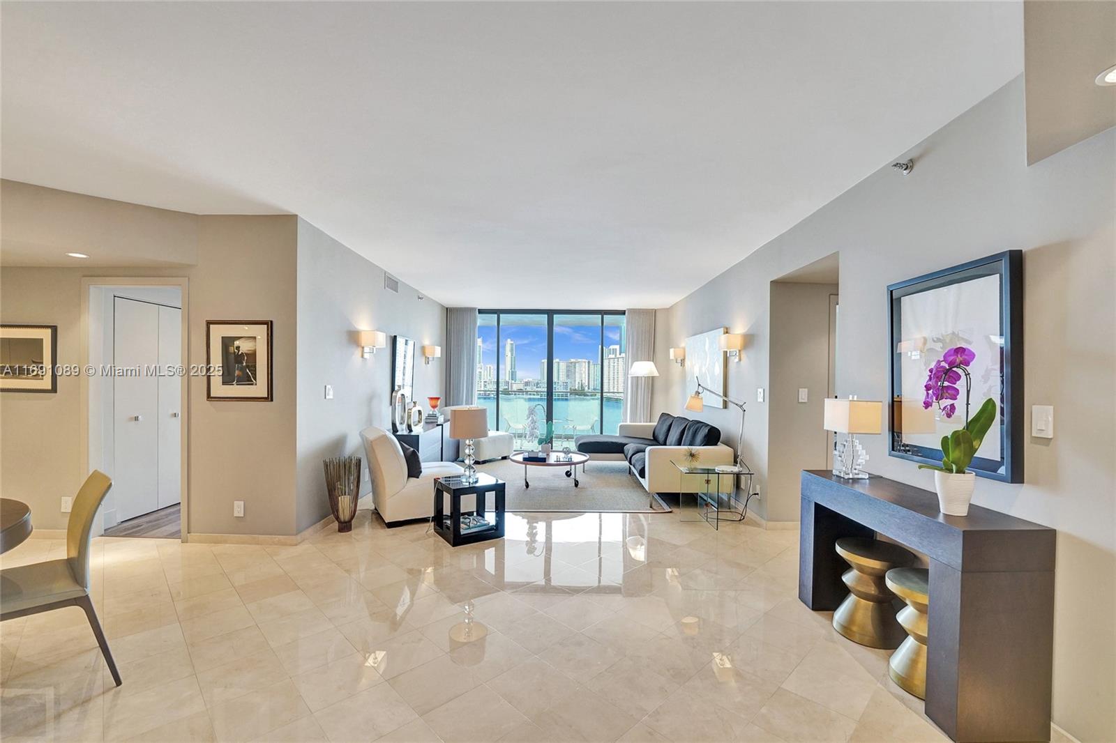 Williams Island is a private luxury fitness and wellness community located on the Intracoastal in Aventura. The community offers 3 restaurants: The Island Club, The Island Grille, and The Pool Bar. The Spa offers classes and treatments daily. The Tennis Center has 15 courts and 4 Pickleball courts. Courtside Marketplace offers prepared foods. Boaters enjoy the Williams Island Marina. The Biostation and Force Physical Therapy have offices on site. The updated 1,690 sqft 2/2 unit features a stunning direct view of the intracoastal with floor to ceiling windows that open to a large balcony that runs the entire length of the unit. This is a highly desirable 01 line unit. Other amenities include 24 hour security, concierge, complimentary valet parking, and a saltwater pool with towel service.