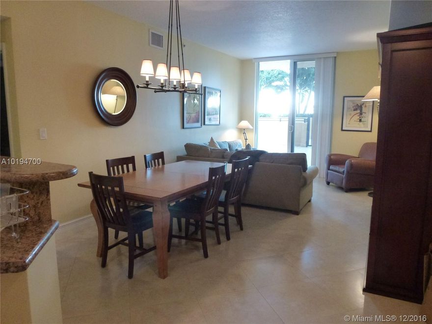 A secret gem of a BOUTIQUE condo building in the center of Coral Gables which rarely has available units for sale. An easy short walk to all attractions plus low maintenance costs in a pristine 2003 building. Open kitchen to living/dining room overlooking an enormous outdoor patio connecting to the jogging path and on the same floor as the gym and pool.  This unique condo has two bedrooms and baths PLUS a separate den which can be used as another bedroom.  All tile floors, tub and shower in master bath.