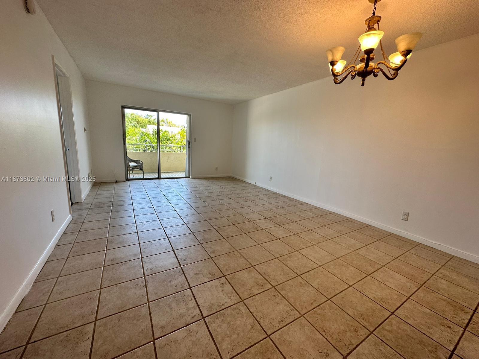 Charming and roomy 2-bedroom/1-bathroom condo boasting a view of the pool. Features central air conditioning, tiled flooring, an attractive kitchen, a mirrored bathroom, and a sizable balcony facing east. Includes one designated parking space.