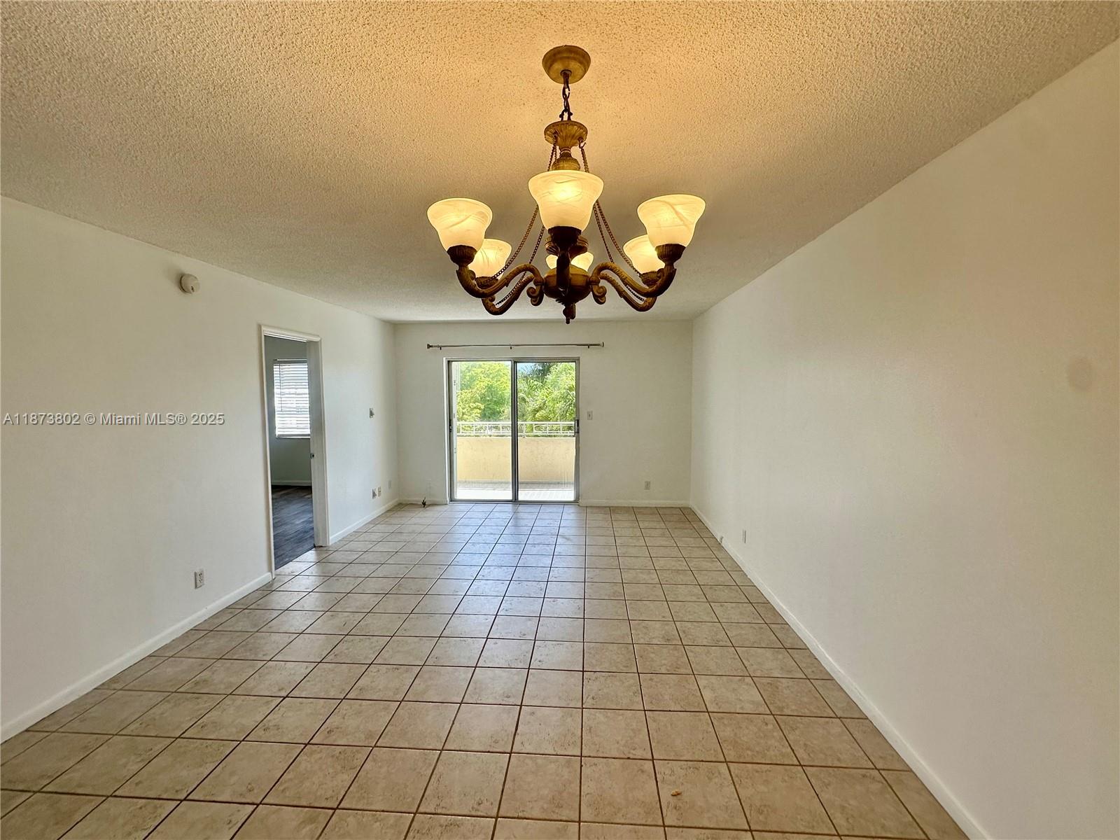 Charming and roomy 2-bedroom/1-bathroom condo boasting a view of the pool. Features central air conditioning, tiled flooring, an attractive kitchen, a mirrored bathroom, and a sizable balcony facing east. Includes one designated parking space.