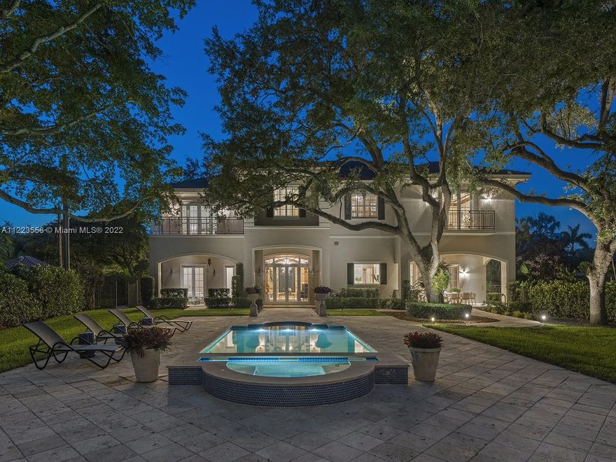 Enchanting lakefront Mansion located in sought after Hammock Lakes, surrounded by over an acre of pristine & manicured landscaping while enjoying breathtaking waterfront views. Welcomed by an awe-inspiring foyer, soaring ceilings, & elegant formal living rm. This impressive estate features a spectacular entertainment floorplan w/ ground floor offering a spacious family rm, wet bar, gourmet kitchen, butlers pantry, media rm, and 2 en-suite bedrooms. Lavish Master suite located upstairs w/study, huge walk-in closet & resort-style bath w/ whirlpool spa & balcony. Find 3 add’l en-suite bedrooms & private library overlooking mature oaks. Escape into a magical tropical oasis featuring covered terraces, summer kitchen pool/spa, & picturesque pathway leading to concrete dock & private sandy beach.