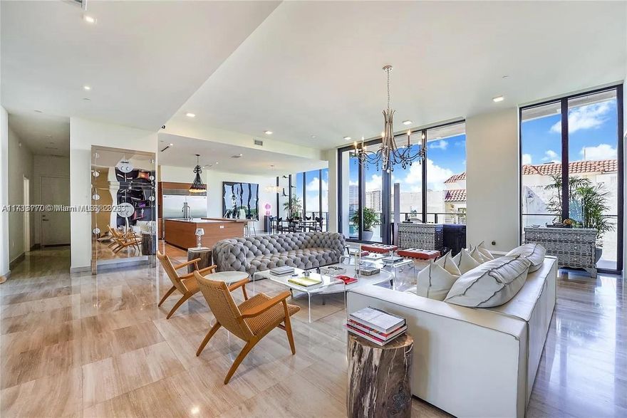 Welcome to Penthouse 605 at The Fairchild, Coconut Grove—an architectural masterpiece where waterfront living meets timeless design. This 4-bedroom + service quarters, 5.5-bath home spans 3,886 SF with 13' ceilings, natural stone floors, and floor-to-ceiling windows framing panoramic bay and city views. A Poliform kitchen with Wolf and Sub-Zero appliances and wet bar anchor the expansive layout, perfect for entertaining. Enjoy over 1,200 SF of private terraces and resort-style amenities including a rooftop pool, cabanas, summer kitchen, BBQ area, spa, hammam, sauna, and fitness center. Don’t miss this opportunity to own the best-priced penthouse in all of Coconut Grove. Owner financing available.