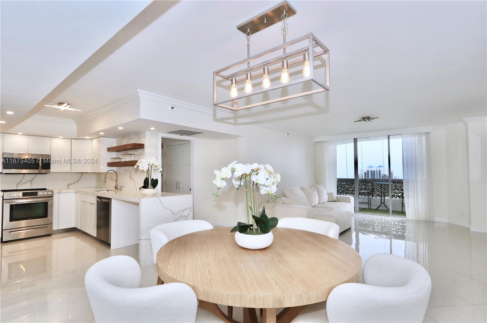 Experience exceptional ocean views from every room in this stunning lower penthouse, featuring floor-to-ceiling windows that flood the space with natural light. This remodeled unit boasts luxury finishes throughout, with no expense spared. The split floor plan offers privacy, with a spacious primary suite that includes an ensuite bathroom and walk-in closets complete with custom built-ins. Washer & dryer inside the unit. A perfect blend of elegance and functionality, this home is a rare find with breathtaking views and top-tier upgrades The building offers a wealth of amenities, including: fitness center, heated pool, library, 7 clay tennis courts, 4 pickleball courts, basketball court, dog park, mini market, a beauty salon, e-car charging stations,an on-site restaurant & convenience shop.