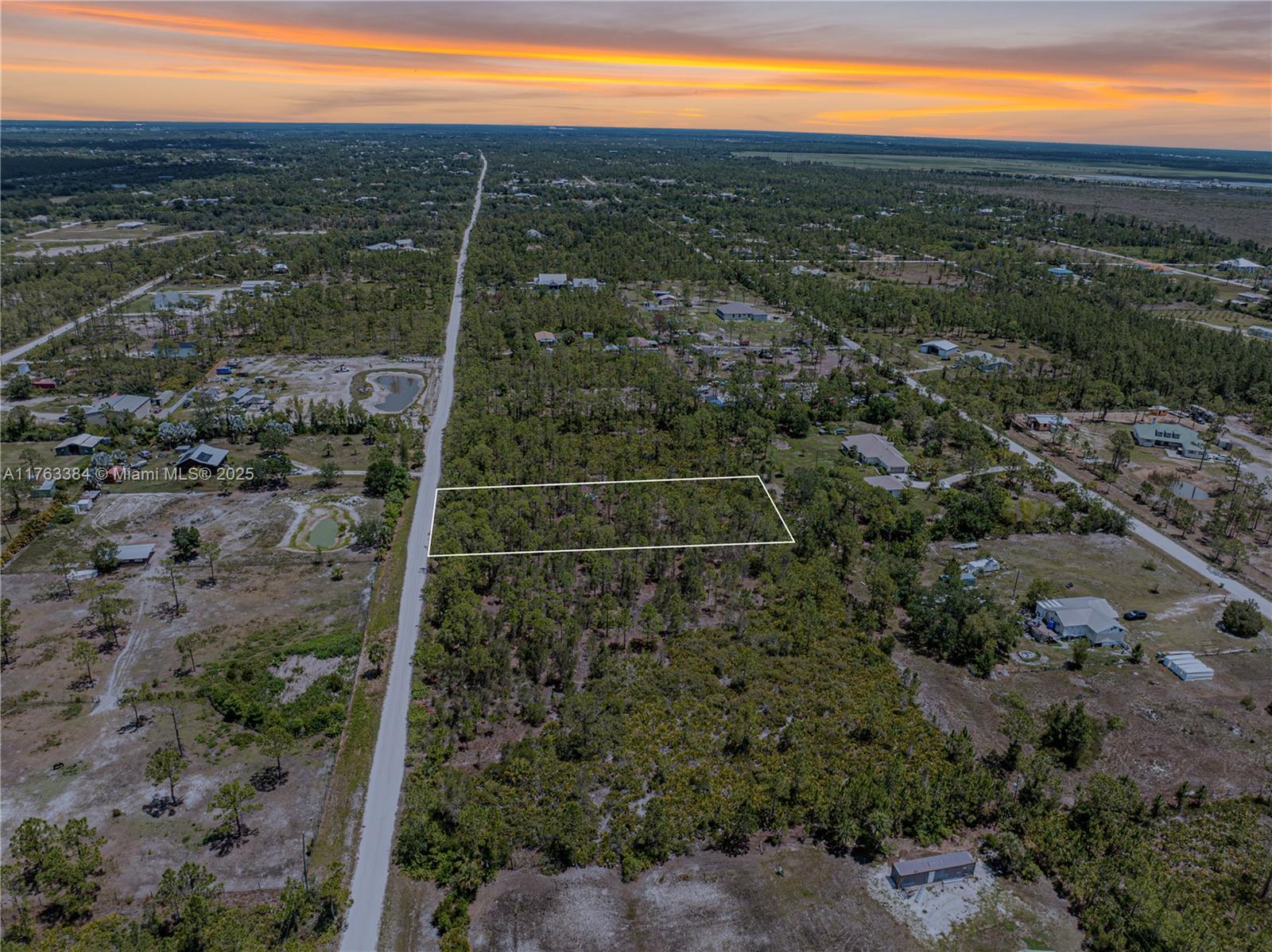 Just minutes from I-75, downtown Punta Gorda, and Fisherman's Village, you can find peace while enjoying Florida's wildlife. This 1.25-acre property has no HOA restrictions and is located in an agricultural zone, allowing you to have animals, and horses, raise chickens, and even run a small farm—all while being close to town