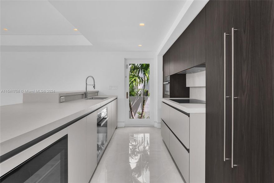 5 BEDROOM 4 BATH COMTEMPORARY RESIDENCE. This amazing home offers Italian Kitchen cabinets with top-of-the-line appliances, beautiful pool with a sheer decent feature, outdoor patio, private terraces and roof top deck. Must see!! Easy to show.
