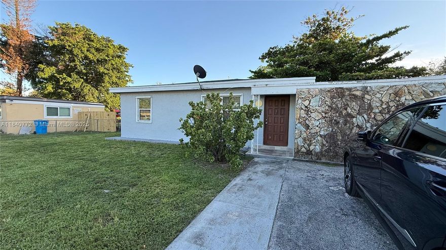 SINGLE FAMILY HOME IN A HUGE LOT MORE THAN 10K SF- EASY TO CONVERT INTO A GREAT MULTIFAMILY - WEST PARK. GREAT CONDITION. Nestled on a spacious 10,327 sqft lot, this detached one-story residence offers comfortable living, a large fenced yard and ample parking, including a wide driveway. Inside, enjoy a bright and inviting layout with ceramic tile flooring, a functional eat-in kitchen. Equipped with central A/C, electric range, refrigerator, microwave, and washer. Located in the desirable Miami Gardens Estates subdivision, with easy access to major highways, schools, shopping, and dining. No HOA, no rental restrictions—perfect for homeowners or investors alike! Plenty of room to expand, add a pool, or create your ideal outdoor space.