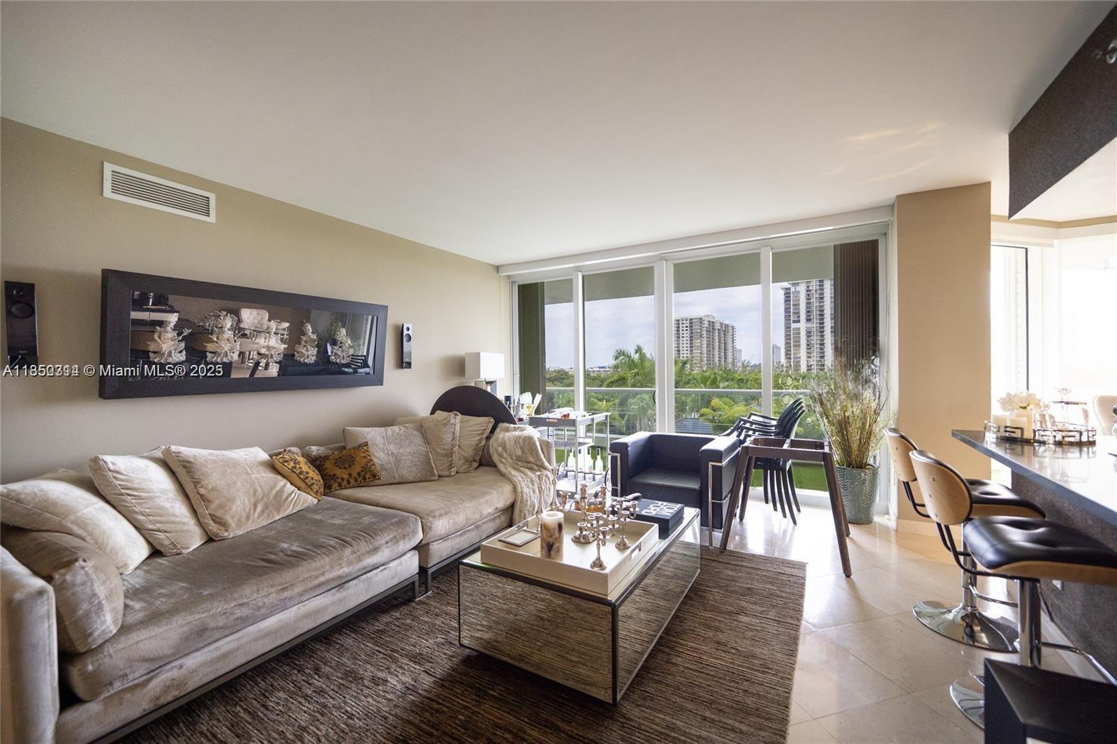 Welcome to your new furnished home in the oasis of Williams Island. The residence is composed of three bedrooms (the den was converted into a full spacious third bedroom). The apartment has been repainted, remodeled before the pandemic and the kitchen appliances have been updated. The master bedroom is equipped with an extra large walk-in closet. Expansive balcony overlooking the lush landscape of the exquisite island. We welcome you to visit your new home and enjoy the magnificent amenities only found on magical Williams Island. Unit comes with storage and two valet parking spaces.
