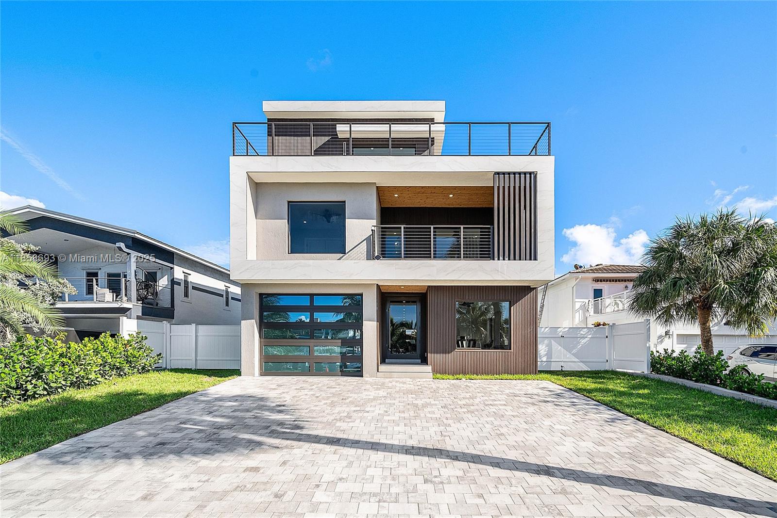 Experience the ultimate in coastal luxury living at this brand-new 3-story modern masterpiece in Pompano Beach! Just a 2-minute stroll to the beach, this 5-bed, 5-bath waterfront home offers 3,791 sq ft under AC, ~1,000 sq ft of balconies, and sweeping water views from every level. The 50-ft private dock accommodates a 28–30 ft boat plus jet skis, providing direct ocean access for endless days on the water.
Designed for style and function, the property features a private pool, outdoor lounge, and parking for up to 8 cars (including 1-car garage). Perfect for entertaining or relaxing, the open living spaces flow seamlessly to expansive terraces. This is coastal South Florida living at its finest — modern design, prime location, and unparalleled water access.