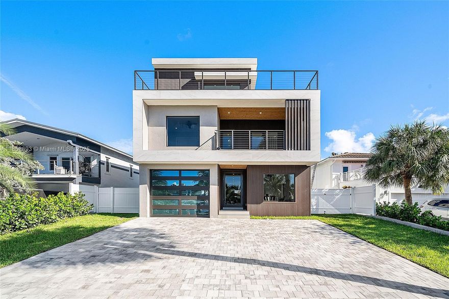 Experience the ultimate in coastal luxury living at this brand-new 3-story modern masterpiece in Pompano Beach! Just a 2-minute stroll to the beach, this 5-bed, 5-bath waterfront home offers 3,791 sq ft under AC, ~1,000 sq ft of balconies, and sweeping water views from every level. The 50-ft private dock accommodates a 28–30 ft boat plus jet skis, providing direct ocean access for endless days on the water.
Designed for style and function, the property features a private pool, outdoor lounge, and parking for up to 8 cars (including 1-car garage). Perfect for entertaining or relaxing, the open living spaces flow seamlessly to expansive terraces. This is coastal South Florida living at its finest — modern design, prime location, and unparalleled water access.