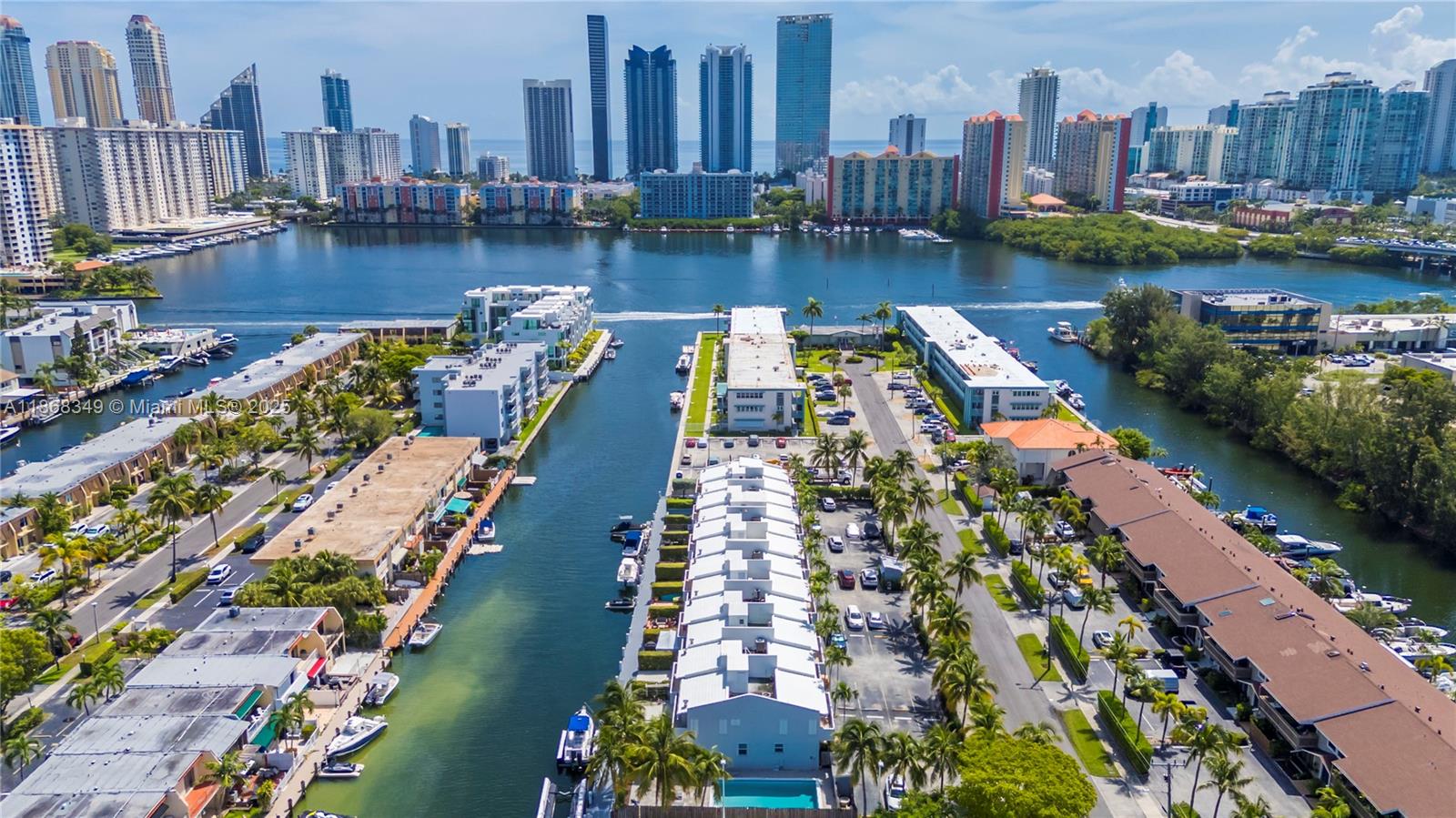 30 FEET DOCK included. Waterfront Townhome 3 bedrooms / 2 1/2 bathrooms. 30 Feet Dock space directly behind your townhome! Just minutes to the Ocean ( Haulover inlet) - No fixed bridges to Ocean! Porcelain title floors, Updated kitchen w/ stainless steel appliances with white cabinets and Granite countertop, upgraded Bathrooms, 2 parking spaces, 24-hour guard gate community of Eastern Shores. Conveniently located minutes away to restaurants, Grocery Store, Shopping, IPIC Movies, Oleta Park and Beach! 30 Feet Dock space directly behind your townhome! This home is protected by IMPACT WINDOWS