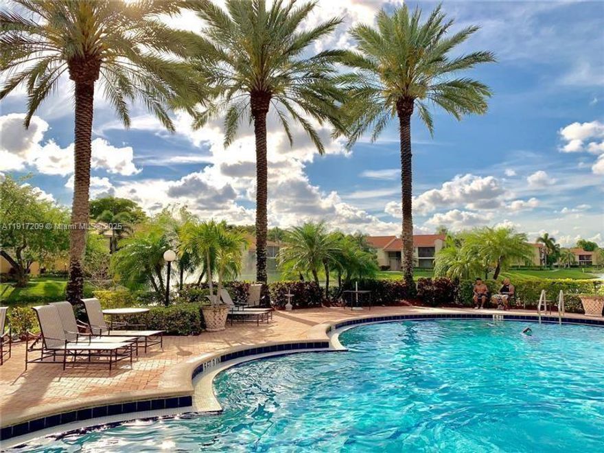 GATED COMMUNITY First floor beautiful lake view corner condo .The kitchen has stain steel appliances . kitchen and  the bathroom were renovated .The condo has central AC , washer and dryer .Great Amenities