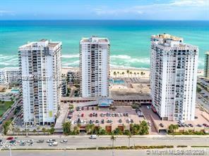 Beautiful Corner unit located in QUADOMAIN, 2- 2 an oceanfront community! Partial water views from the balcony. Direct beach access. World-class amenities: 2 heated pools, gym, sauna, billiards and golf rooms, a grandkids' room, hair salon, and business center. Enjoy yoga, water aerobics and other classes, beach chair service, an on-site restaurant, valet parking and 24-hour security. A short walk to the Hollywood Beach Broadwalk. This beautifully remodeled building has completed its 40-year certification and is conveniently located near Publix, FLL Airport, Gulfstream Casino and many vibrant shopping centers. Includes upper-level garage parking. Lowest priced 2Br in complex