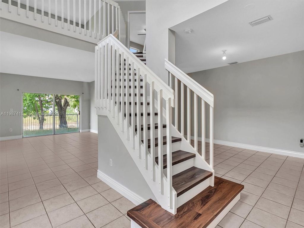 Photo of 1498 SW 106th Ave #1498, Pembroke Pines, FL 33025 (MLS # A11987410)