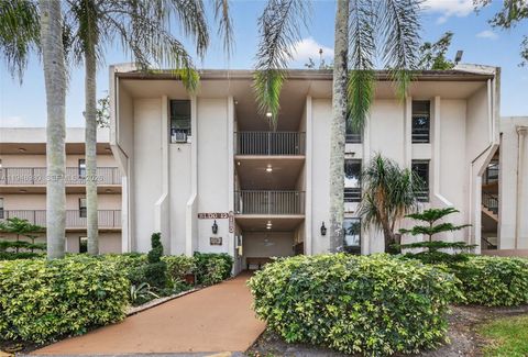 Photo of 8150 W Mcnab Rd #304, Tamarac, FL 33321 (MLS # A11948980)