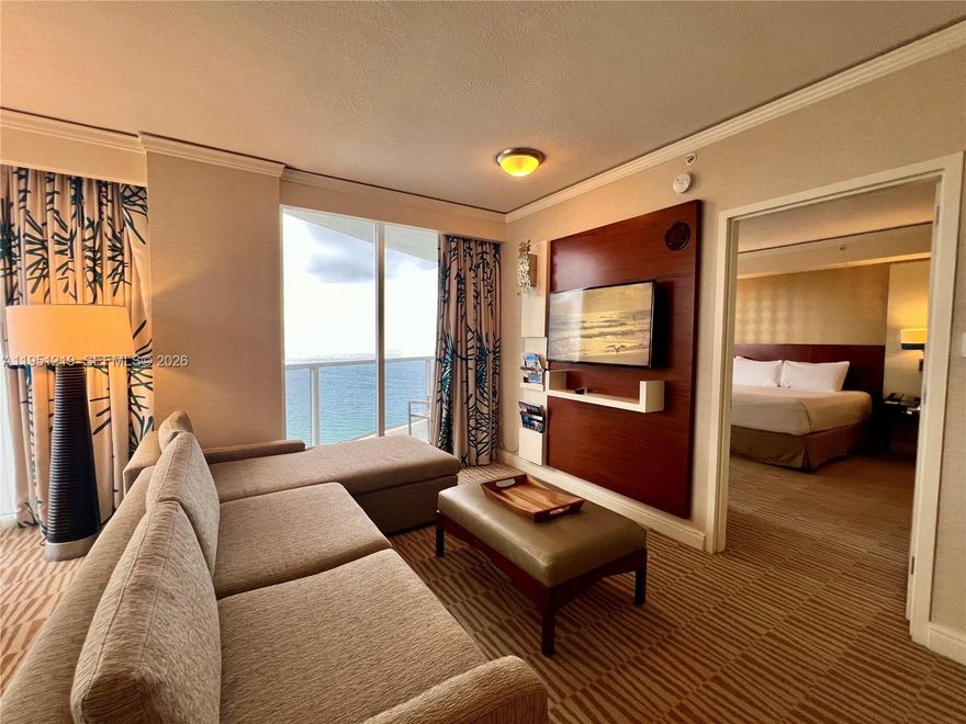 Oceanfront condo-hotel residence with over 1,021 sq ft of interior space and a private balcony offering sweeping views. This fully furnished unit features a complete kitchen, expansive living and dining area, elegant bathroom, in-unit washer and dryer, walk-in closet, dedicated owner’s closet with lock, and a built-in workstation—ideal for both leisure and business stays. Enjoy world-class resort-style amenities, including direct beach access with service, oceanfront dining, full-service spa, state-of-the-art fitness center, tennis courts, two resort pools, valet parking, and 24-hour security. Currently part of the hotel program, this unit generates steady income and offers flexible personal use. A premier beachfront investment in the heart of Sunny Isles Beach.