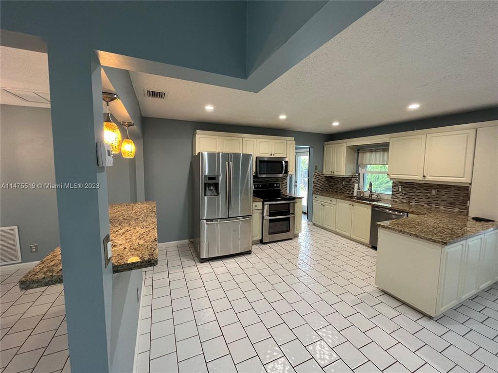 Photo of 11291 NW 39th Ct, Coral Springs, FL 33065 (MLS # A11475519)