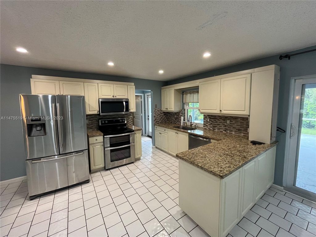 Photo of 11291 NW 39th Ct, Coral Springs, FL 33065 (MLS # A11475519)