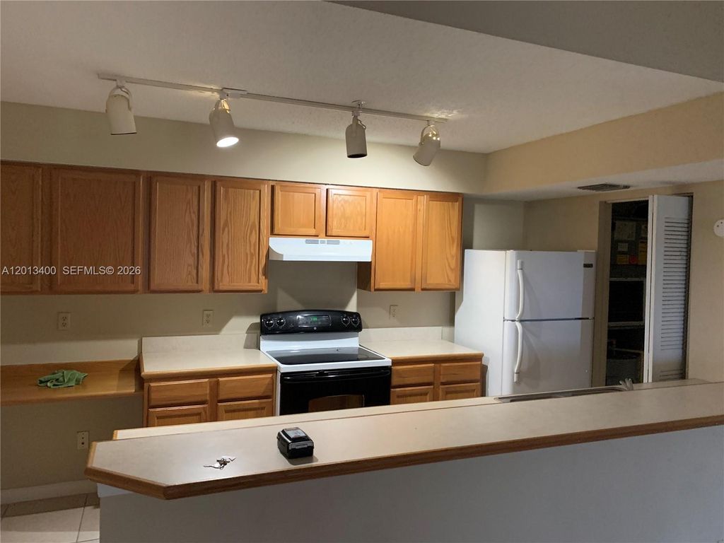 Photo of 9905 Westwood Dr #37-3, Tamarac, FL 33321 (MLS # A12013400)