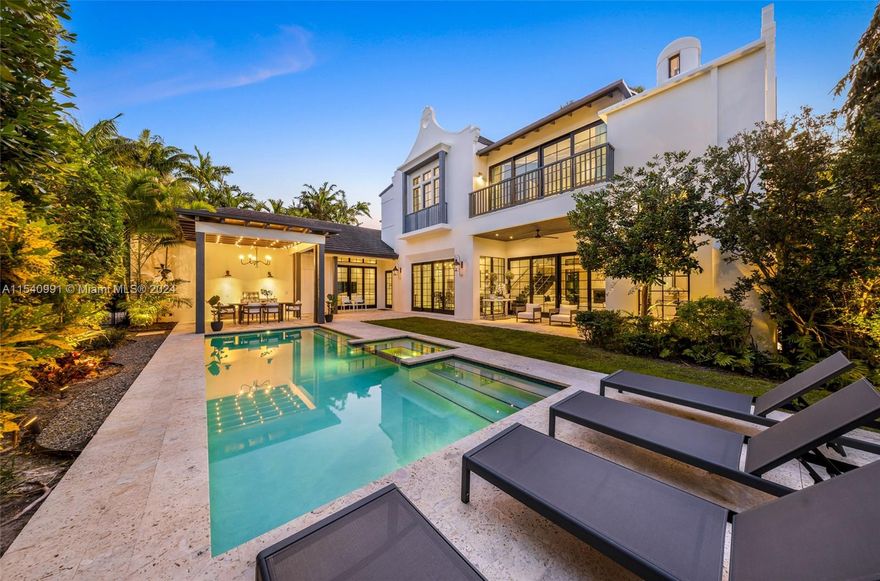 Caribbean-Dutch inspired architectural home in the gated community of Morningside. Built from the ground up in 2016, this unique residence is ideally positioned on a charming corner in the northern sector of Morningside. Within walking distance to parks, the bay & short drive to the Design District, top-rated schools, and fine dining establishments. Volume ceilings, luxurious finishes, chef's kitchen with 12 FT marble island, sanctuary primary suite and enchanting exterior garden and pool. The luminous interior showcases floor-to-ceiling glass doors leading to a private covered patio, summer kitchen, and sparkling pool. Custom walk-in closets in every bedroom, impact glass windows, Luxury appliances, and a full-size generator, this home harmoniously blends comfort, security, and elegance.