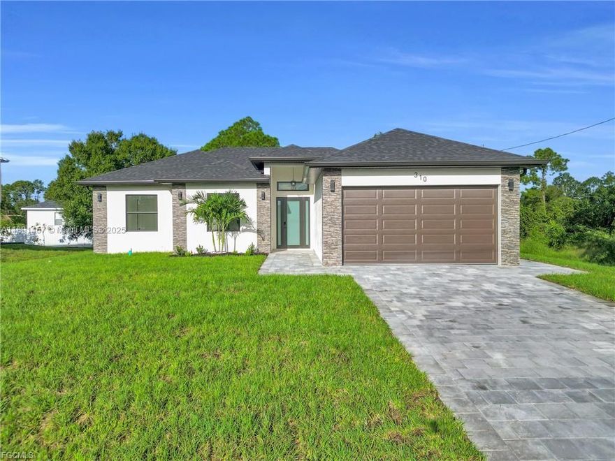 10K in Seller concessions available! This brand-new 2025 home at 310 Lenz Ave S, Lehigh Acres offers 3 bedrooms, 2 bathrooms, and a 2-car garage. Enjoy a modern open-concept layout with stainless steel appliances, sleek cabinetry, tile floors, and impact windows. The outdoor kitchen is perfect for year-round entertaining, while high ceilings and premium finishes add elegance. Washer and dryer included for true move-in readiness! The spacious primary suite features a walk-in closet and stylish bath. Plenty of backyard space for a pool or garden. Conveniently near SR-82, Sunshine Blvd, and Lee Blvd — close to schools, shops, and dining. A must-see modern gem!