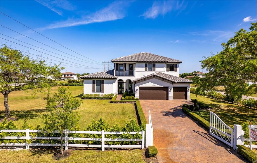 Stunning 2023 estate in Southwest Ranches, set on a fully fenced 1-acre lot -5917 SQFT adjusted area-offering the perfect blend of luxury & functionality. This one-of-a-kind home features a loft-style design, 3car garage, resort-style backyard w/ pool, trampoline & kids’ playground. Enjoy a chef’s kitchen w/top-tier appliances, hardwood floors in all bedrooms and throughout the second floor, plus a full-home automatic generator for peace of mind. The exterior is beautifully lit with 75 recessed LED accent lights. Located in an equestrian paradise, yet just minutes from highways, restaurants, shops, parks, lounges, 15 minutes from Sawgrass Mills Mall and Amerant Bank Arena. Experience the best of both worlds—quiet country living with city convenience. Seller motivated— See 3D virtual tour!