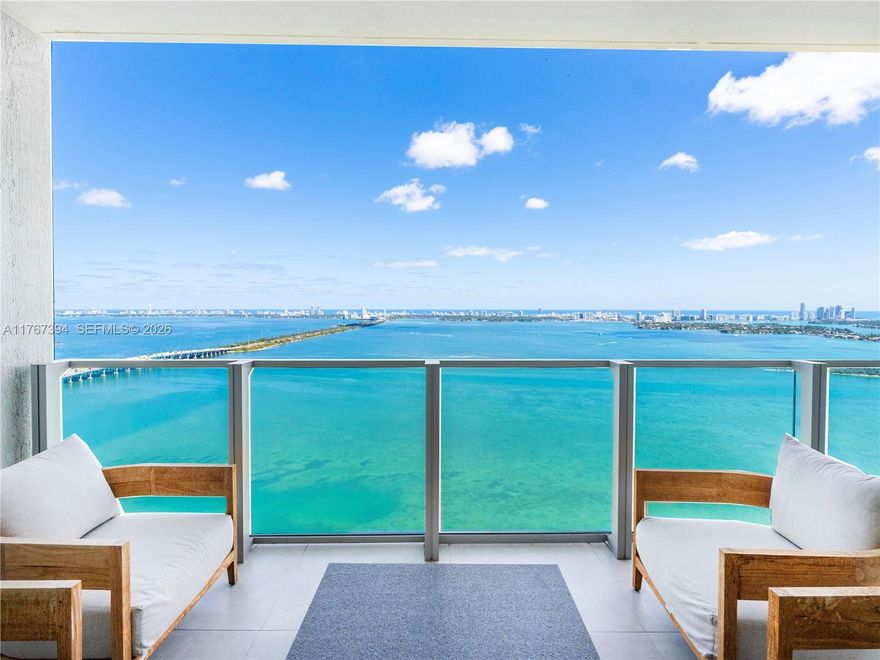 Fully Furnished 2-bed, 2.5-bath condo at Biscayne Beach in the heart of Edgewater.  Beautifully designed with elegant wallpaper throughout,  with designer furniture and finishes. Enjoy breathtaking direct Bay views from your spacious balcony with access from living space and primary bedroom. Features include custom cabinetry in each walk-in closet and bar area, a private elevator foyer entrance, and 2 assigned parking spaces. Biscayne Beach offers resort-style amenities including, two pool decks, resident BBQs, tennis courts, beach volleyball and entertainment area, gorgeous spa, fitness center, and more. Conveniently located near Design District, Wynwood, Miami Beach, and Brickell.