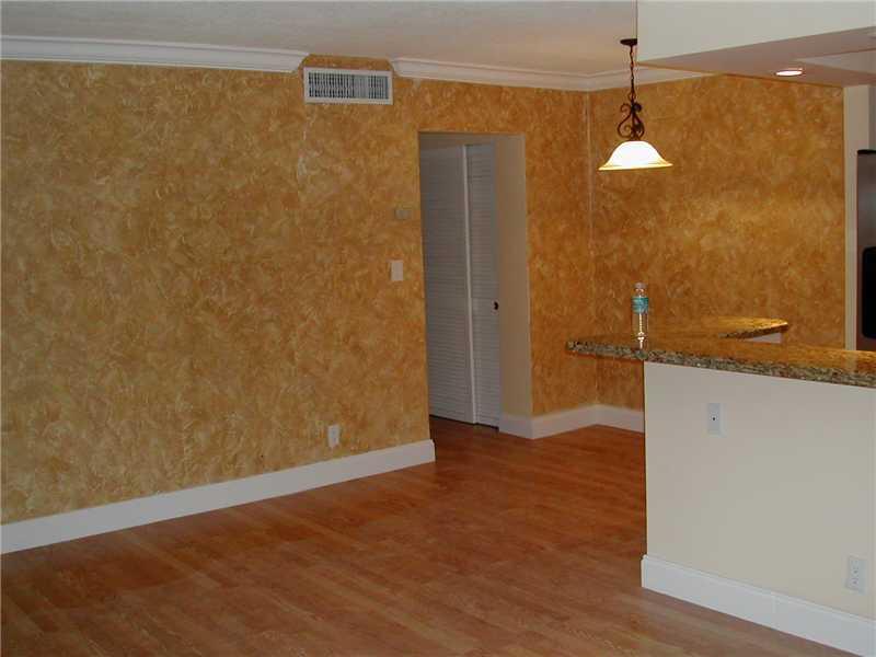 UNDER 55 ALLOWED. PRIVATE CORNER UNIT COMPLETELY REMODELED. OPEN KITCHEN WRAP AROUND BAR WITH CUSTOM WOOD CABINETS, GRANITE COUNTERTOPS AND BACKSPLASH. STAINLESS STEEL APPLIANCES. BRAND NEW BATHROOM-TILED FLOOR TO CEILING, DEEP SINK WITH GRANITE TOP. LAMI NATE WOOD FLOORING THROUGHOUT. CROWN MOULDING. CUSTOM WOOD WINDOW BLINDS. NATURAL PRESERVATION VIEW IN BACK SIDE FOR COMPLETE PRIVACY. FEW BLOCKS TO BEACH. MINUTES TO DOWNTOWN FT. LAUDERDALE, AIRPORT, GULFSTREAM VILLAGES & CASINO.