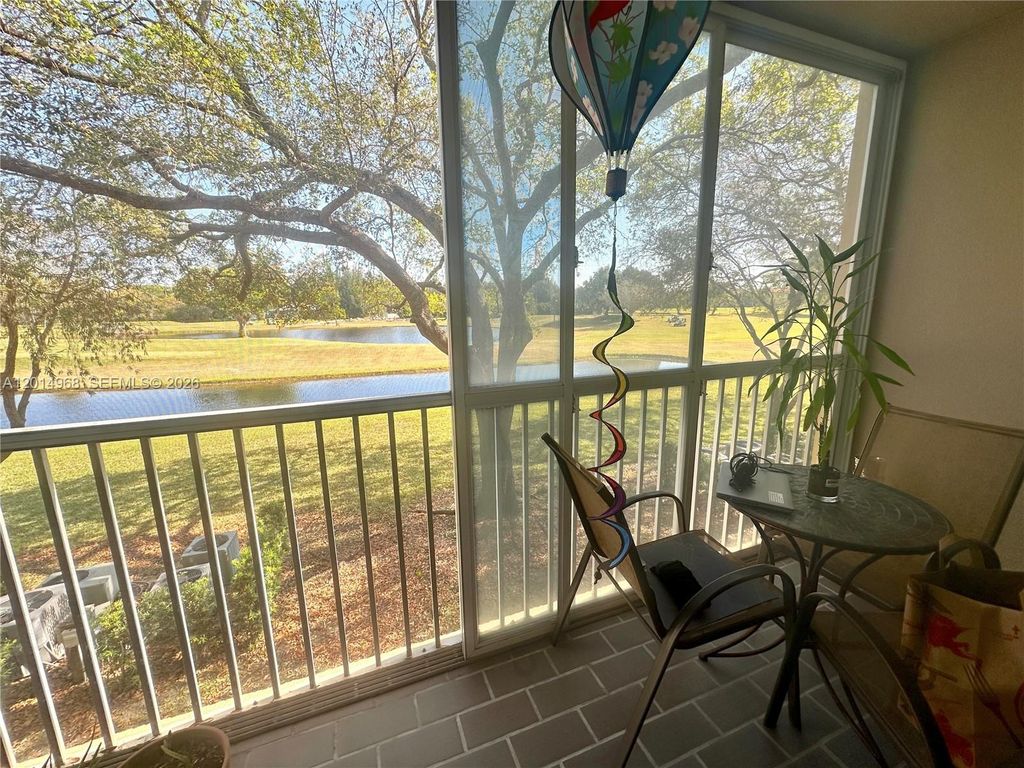 Photo of 1151 SW 128th Ter #210D, Pembroke Pines, FL 33027 (MLS # A12014968)